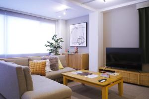 TV a/nebo společenská místnost v ubytování INOVE VILLA Osaka