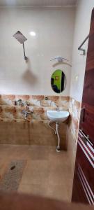 a bathroom with a sink and a mirror at Vista Valley Stay-Gokarna in Kumta