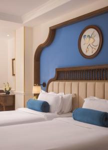 Ένα ή περισσότερα κρεβάτια σε δωμάτιο στο Hanoi Tirant Hotel