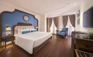 Ένα ή περισσότερα κρεβάτια σε δωμάτιο στο Hanoi Tirant Hotel
