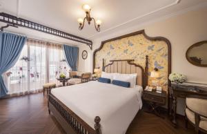 Ένα ή περισσότερα κρεβάτια σε δωμάτιο στο Hanoi Tirant Hotel