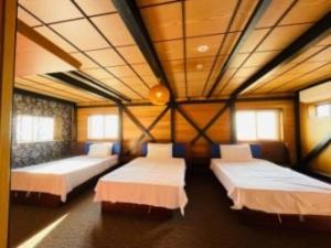 HOTEL COCOA RESORT客房内的一张或多张床位
