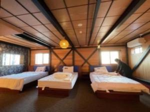 HOTEL COCOA RESORT客房内的一张或多张床位