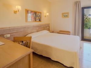 Ein Bett oder Betten in einem Zimmer der Unterkunft Hotel Santa Maria Playa