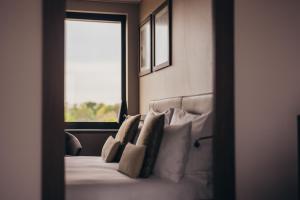 Cama ou camas em um quarto em Crowne Plaza Geneva by IHG