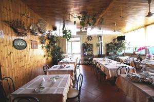 a restaurant with tables and chairs in a room at Holiday Residence in Casamassima