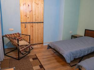 Postel nebo postele na pokoji v ubytování kutaisi base camp