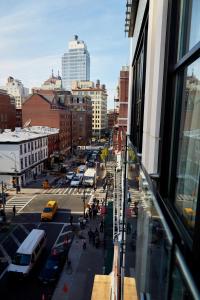 a city street filled with lots of buildings at NobleDEN Hotel in New York