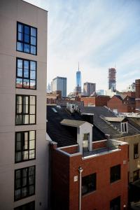 a view of the city from the roof of a building at NobleDEN Hotel in New York