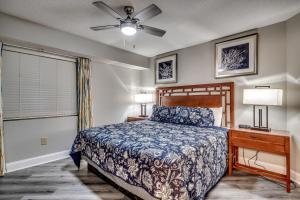 En eller flere senge i et værelse på Dunes Village Resort 1253 + 55 billeder