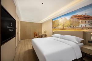 Mynd úr myndasafni af Landis Hotel í Wuqia +37 myndir