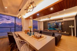 a dining room with a view of the ocean at Blue Sky Beach in Hulhumale