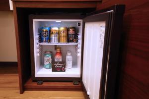 an open refrigerator filled with lots of drinks at ZONK HOTEL Nakasu-Deaibashi in Fukuoka