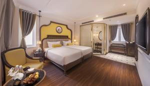 Ένα ή περισσότερα κρεβάτια σε δωμάτιο στο Hanoi Tirant Hotel