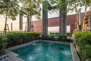 a swimming pool in front of a building at WOODSBURY PREMIER LUXURY SUITE 2B2R 2MIN SUNWAY in Butterworth