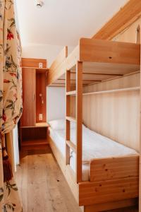 Postel nebo postele na pokoji v ubytování Hotel Gratz Großarl