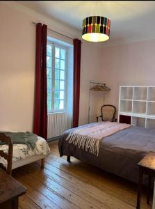 a bedroom with a bed and a large window at Gîte avec piscine près de Bazas et Langon in Sauviac +46 photos