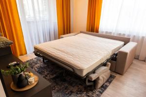 Ένα ή περισσότερα κρεβάτια σε δωμάτιο στο Apart B&V +9 φωτογραφίες