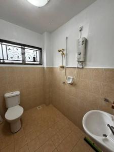 a bathroom with a toilet and a sink at D23 Homestay Bandar Baru Bangi, Selangor in Bandar Baru Bangi