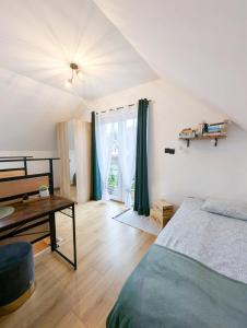 Posteľ alebo postele v izbe v ubytovaní Loft House Rozewie - Całoroczne domki z Balią ogrodową