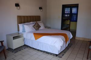 Postel nebo postele na pokoji v ubytování Mountjoy Guest Lodge