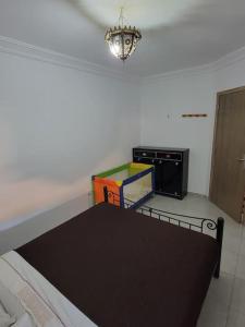 Postel nebo postele na pokoji v ubytování Appartement à Louer, MIftah Sahil Anza