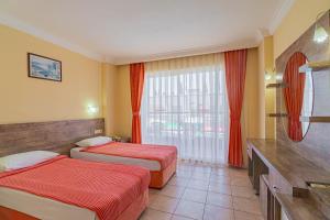 Postel nebo postele na pokoji v ubytování Sayanora Hotel + 37 fotografií