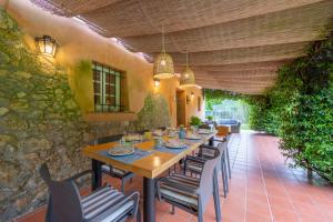 a table and chairs on an outdoor patio at Villa Filippo by Mmega in Santa Lucia