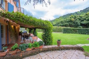 a house with a patio and a yard at Villa Filippo by Mmega in Santa Lucia