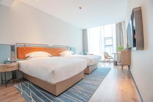 Φωτογραφία από το άλμπουμ του Echarm Hotel Zigong Ma Dangshui Wanda Plaza Branch σε Shuping