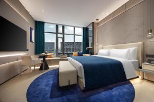 Voodi või voodid majutusasutuse Vance Hotel - Alibaba Xixi C District toas