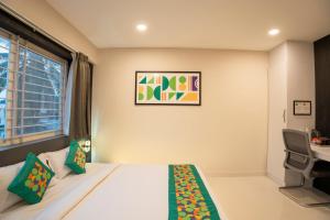 Voodi või voodid majutusasutuse Treebo Sanmaya Retreat, 15 Mins From Mysore Palace toas