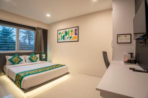 Voodi või voodid majutusasutuse Treebo Sanmaya Retreat, 15 Mins From Mysore Palace toas