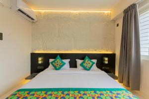 Voodi või voodid majutusasutuse Treebo Sanmaya Retreat, 15 Mins From Mysore Palace toas
