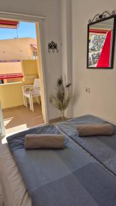 a bedroom with a bed with two pillows on it at Apartment Puerto de Santiago in Puerto de Santiago