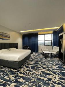 Postel nebo postele na pokoji v ubytování فندق قمم بارك Qimam Park Hotel 6