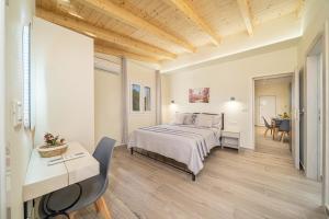 a hotel room with a bed and a desk at Lakithra Comfort Cove in Lakithra
