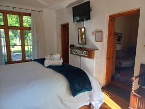 Postel nebo postele na pokoji v ubytování Cypress Cottage