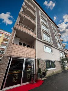 a building with a red carpet in front of it at MİLA SUİTE in Trabzon