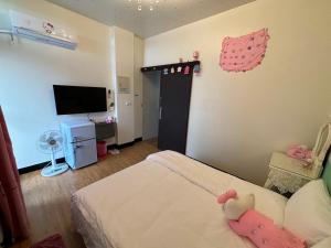 Voodi või voodid majutusasutuse Chaonima B&B 潮尼馬民宿 toas