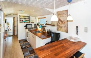 a kitchen with a wooden counter top in a caravan at Two-Bedroom Holiday Home In Hornslet in Hornslet