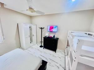 a bedroom with two bunk beds and a mirror at APT Umi 22 in Linate