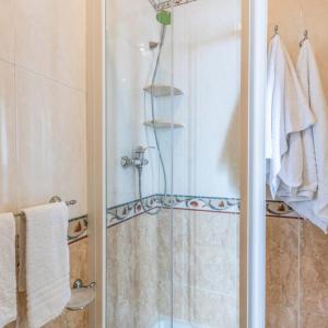 a bathroom with a shower with a glass door at B&B La Riviera in Gallipoli
