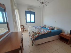 Ένα ή περισσότερα κρεβάτια σε δωμάτιο στο Almyrida Beach Bungalow IPS