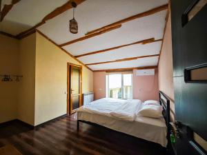 a bedroom with a large bed in a room at Areni Wine Art in Areni
