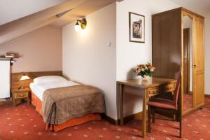 Postel nebo postele na pokoji v ubytování Hotel Regent