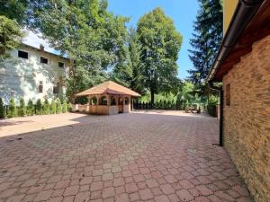 a gazebo in the middle of a driveway at Apartment in Velika Aleja at Ilidža in Sarajevo