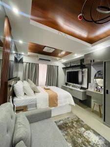 a bedroom with a large bed and a bathroom at Mitch serene shore in Manila +35 photos