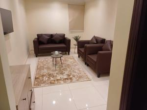 Posezení v ubytování Al tawfeeg hotel - Al Azizyah