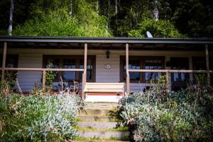 a house with stairs leading to the front of it at Buttercup Hill in Warburton